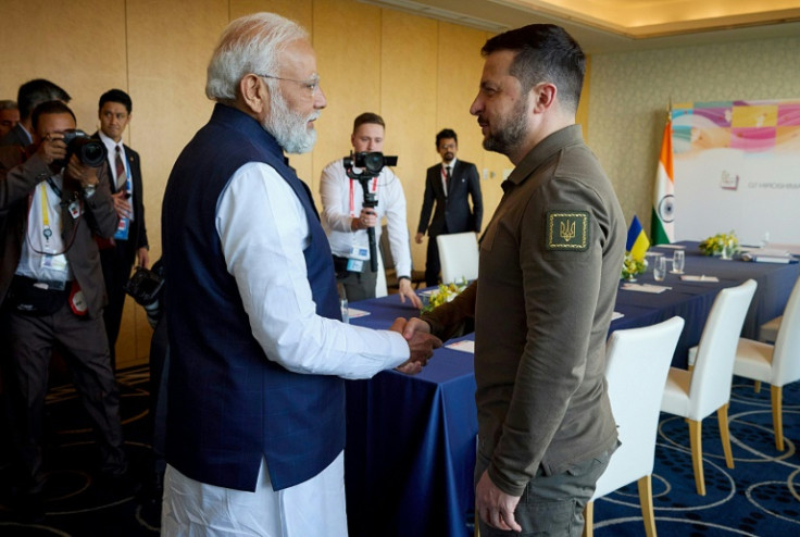This handout photograph taken and released by the Ukrainian Presidential Press Service on May 20, 2023, shows Ukraine's President Volodymyr Zelensky meeting India's Prime Minister Narendra Modi in Japan