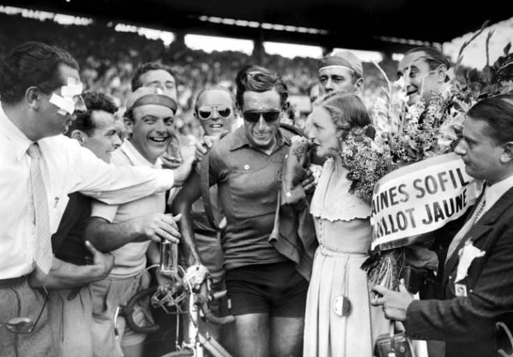 Fausto Coppi (C) on his arrival at the Parc de Princes in Paris after winning his first Tour de France in 1949