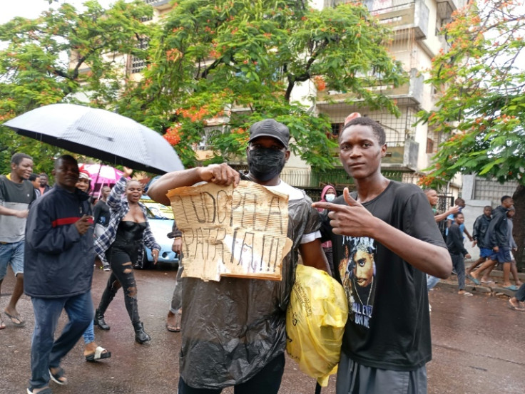 Supporters turned out to welcome Mondlane back, holding placards and chanting his name