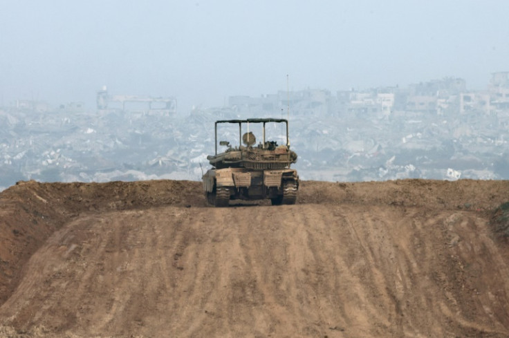 An Israeli army vehicle on a hill overlooking northern Gaza